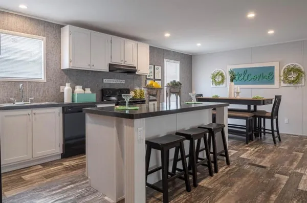 a bathroom with double vanity sinks and a mirror