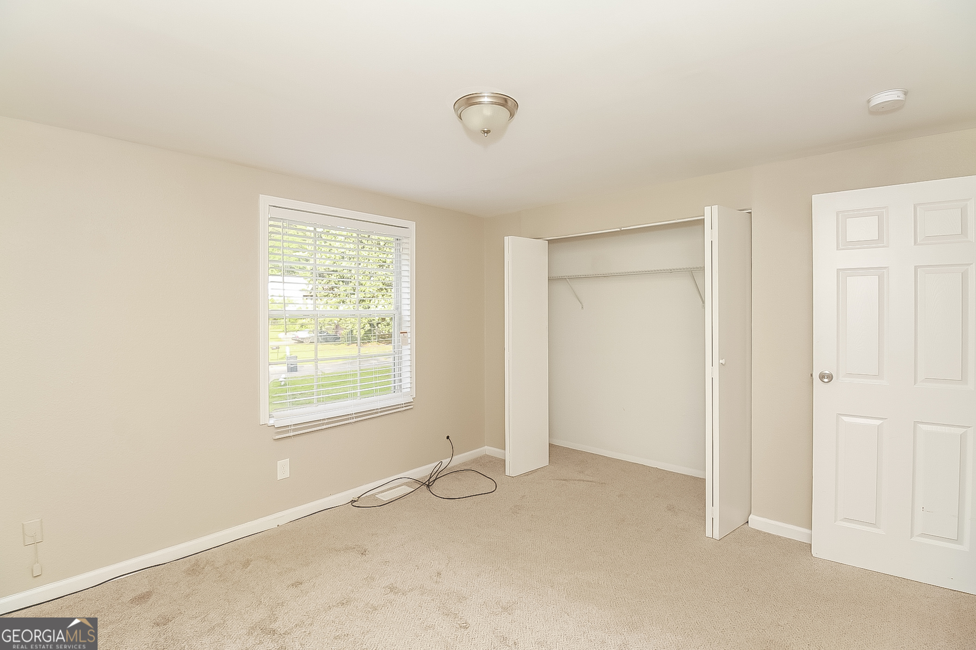 3100 Forestside Court Atlanta, GA 30349 - Photo 13 of 17 an empty room with windows