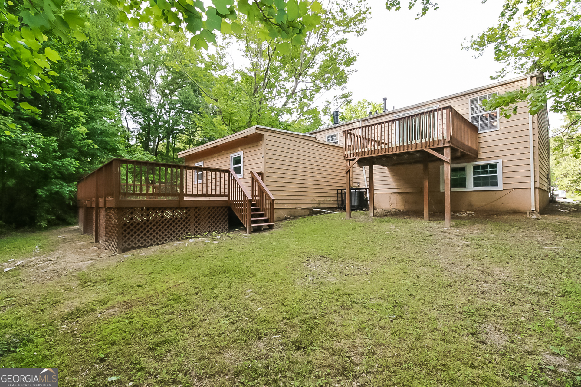 3100 Forestside Court Atlanta, GA 30349 - Photo 15 of 17 a view of a house with a yard