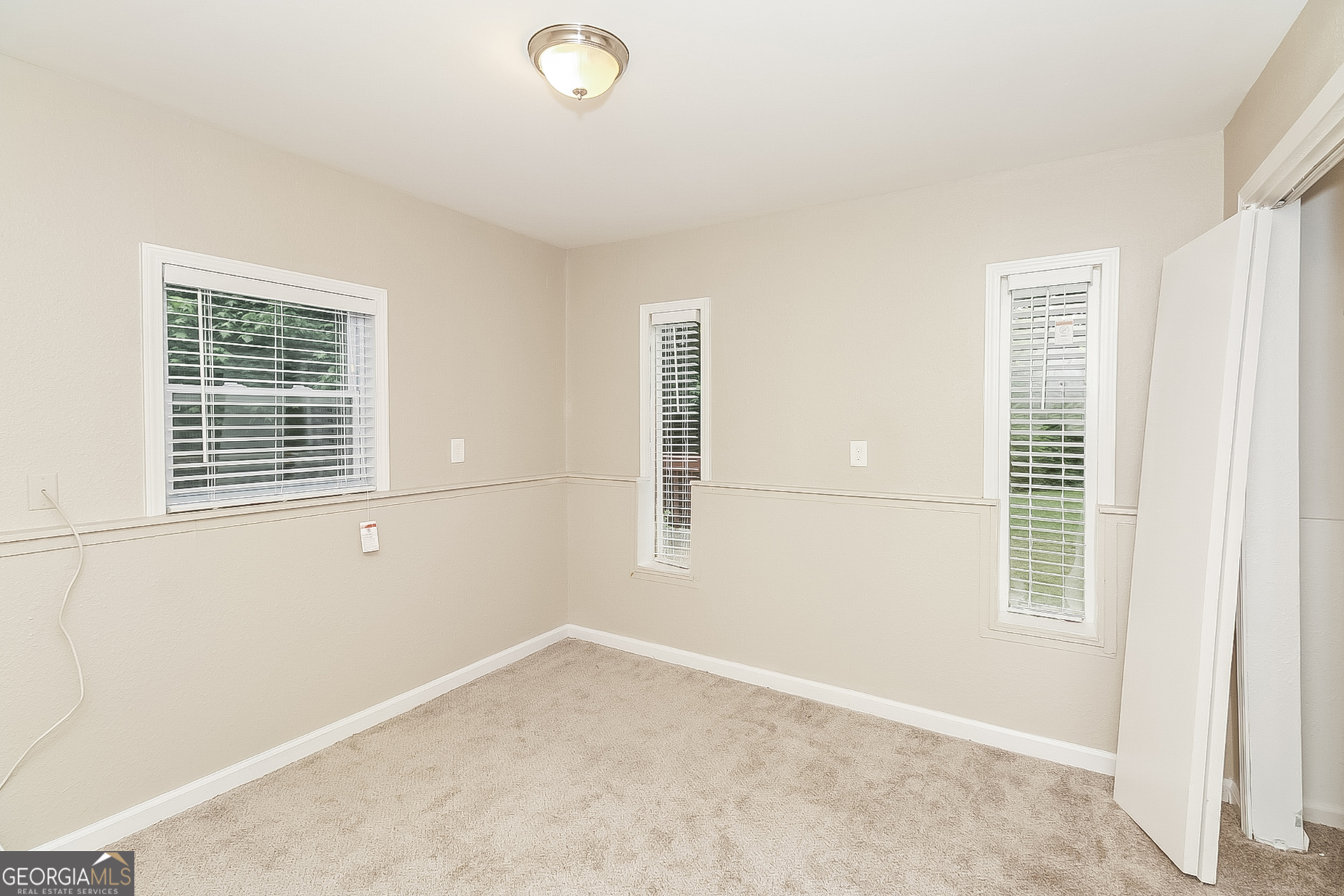 3100 Forestside Court Atlanta, GA 30349 - Photo 8 of 17 an empty room with windows