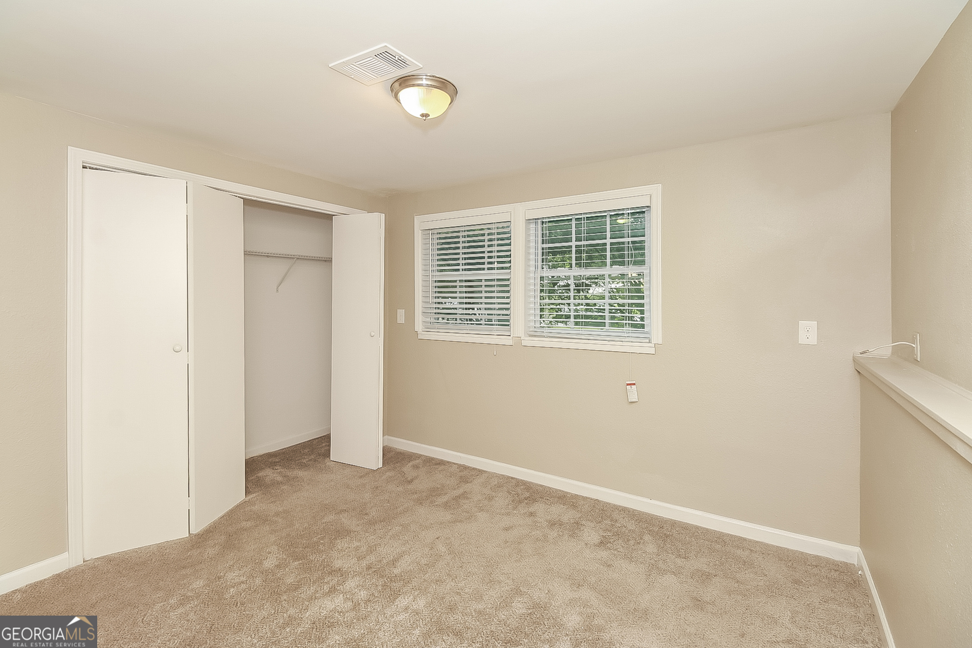3100 Forestside Court Atlanta, GA 30349 - Photo 10 of 17 an empty room with a window