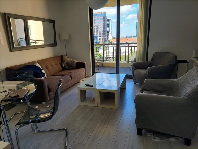 a living room with furniture and a window