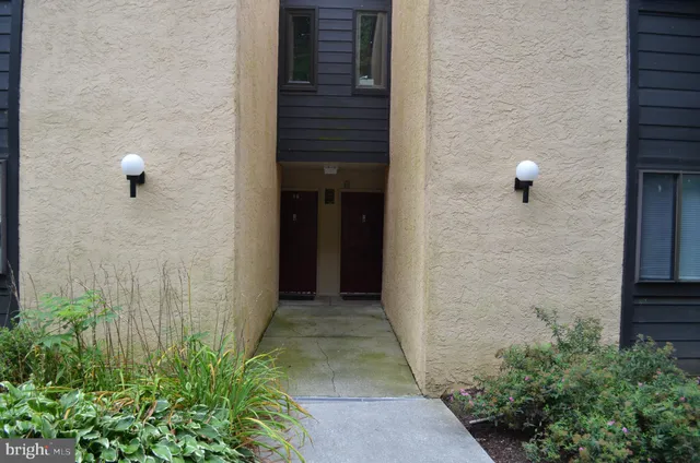 a view of a brick wall of the house