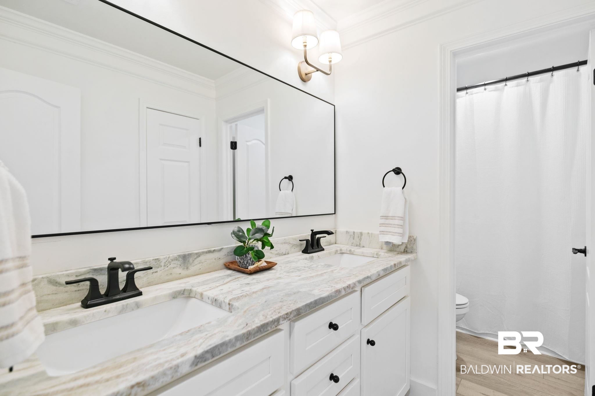 342 Ridgewood Drive Daphne, AL 36526 - Photo 16 of 36 Bathroom with hardwood / wood-style flooring, toilet, double vanity, and ornamental molding