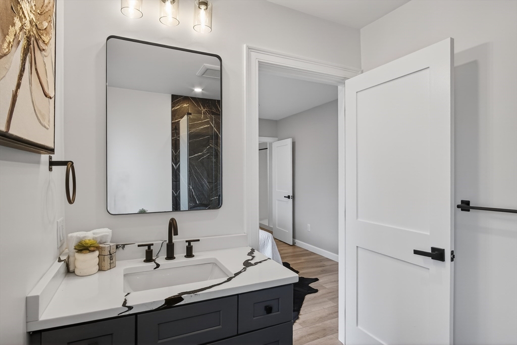 5 Springdale Avenue Saugus, MA 01906 - Photo 17 of 26 a bathroom with a sink and a mirror