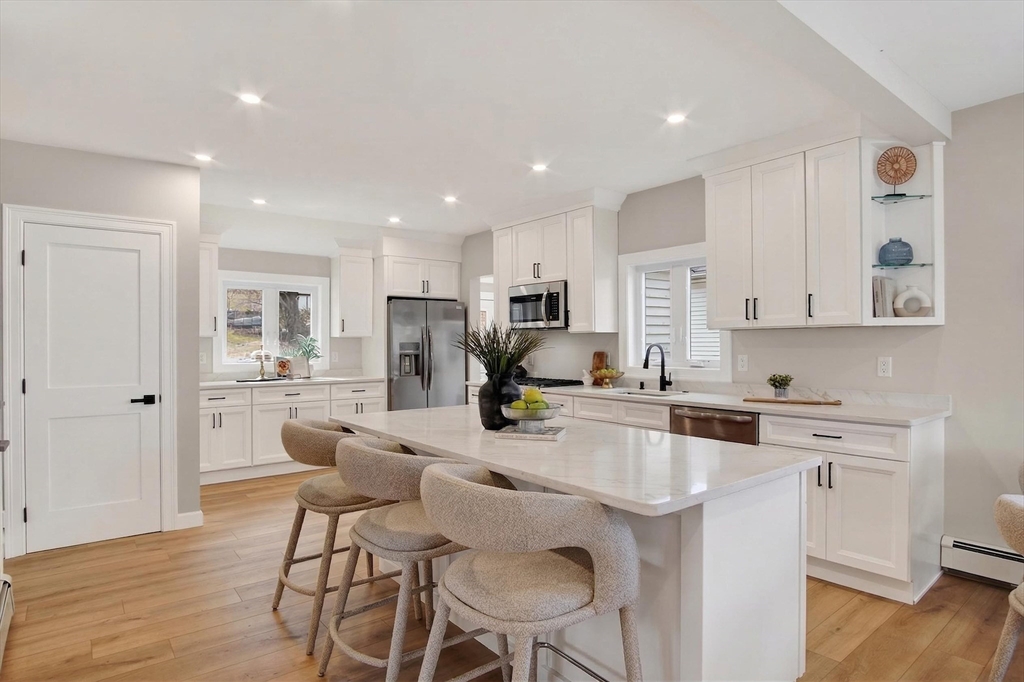 5 Springdale Avenue Saugus, MA 01906 - Photo 2 of 26 a kitchen with stainless steel appliances kitchen island granite countertop a sink and cabinets