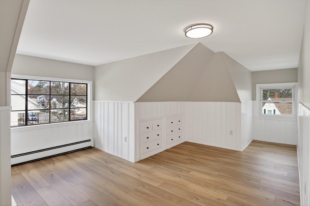 5 Springdale Avenue Saugus, MA 01906 - Photo 22 of 26 an empty room with wooden floor and windows