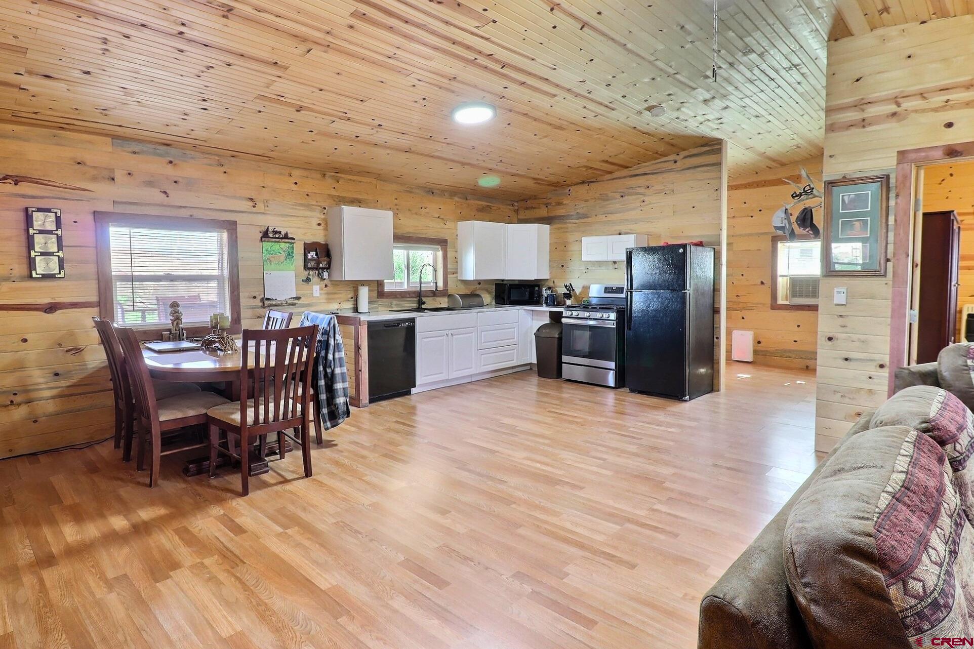 5676 Peach Valley Road Delta, CO 81416 - Photo 21 of 31 Looking into the kitchen dining area of the great room from the livingroom