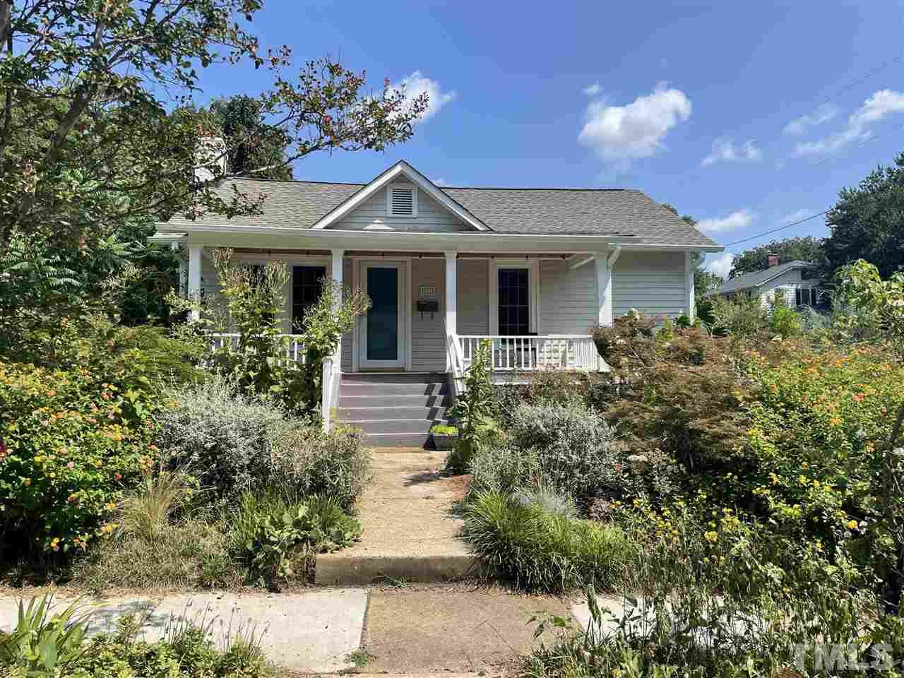 511 Frank Street Raleigh, NC 27604 - Photo 1 of 26 a front view of a house with a yard
