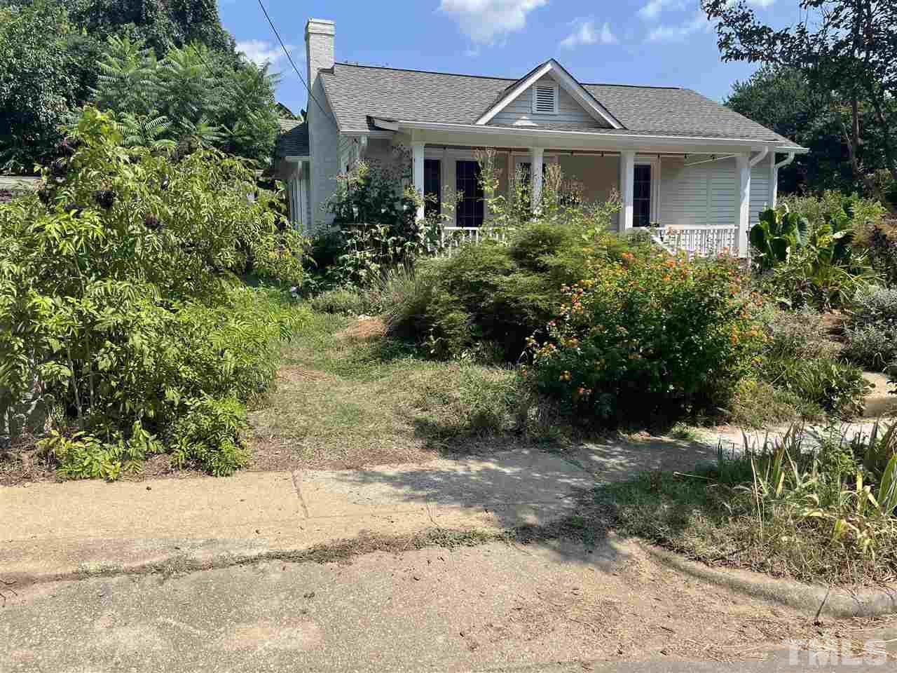 511 Frank Street Raleigh, NC 27604 - Photo 2 of 26 a front view of a house with a yard