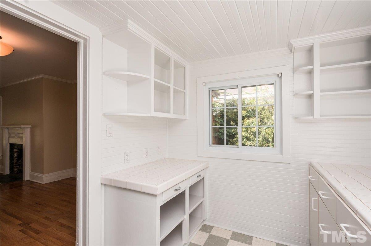 511 Frank Street Raleigh, NC 27604 - Photo 14 of 26 a view of an empty room with wooden floor and a window