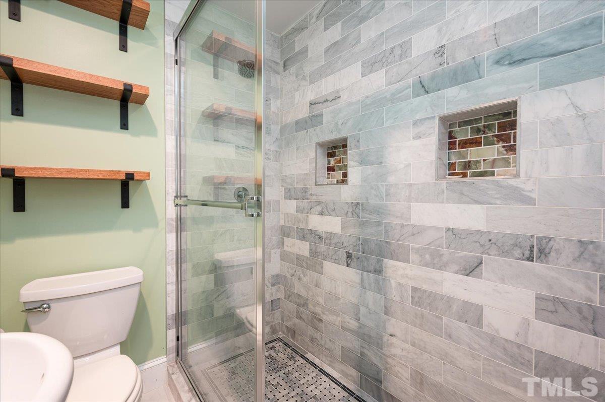 511 Frank Street Raleigh, NC 27604 - Photo 19 of 26 a bathroom with a toilet and a shower