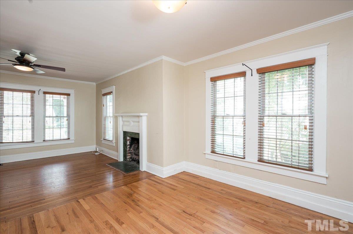 511 Frank Street Raleigh, NC 27604 - Photo 9 of 26 wooden floor fireplace and windows in an empty room