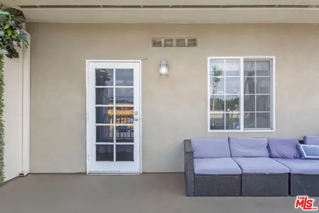 a living room with furniture and windows