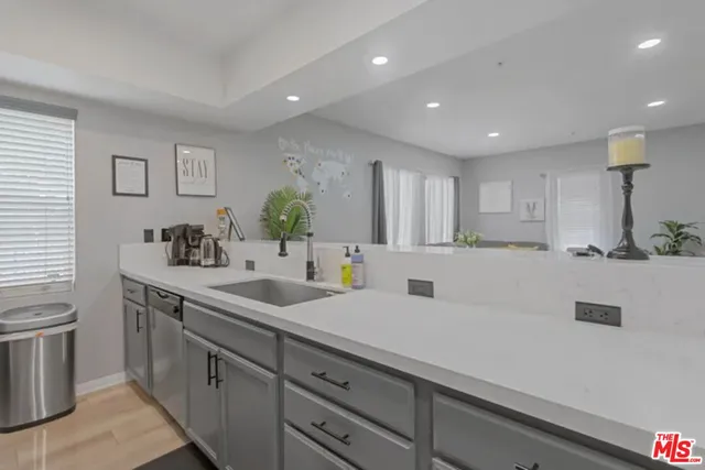 a kitchen with a sink and cabinets