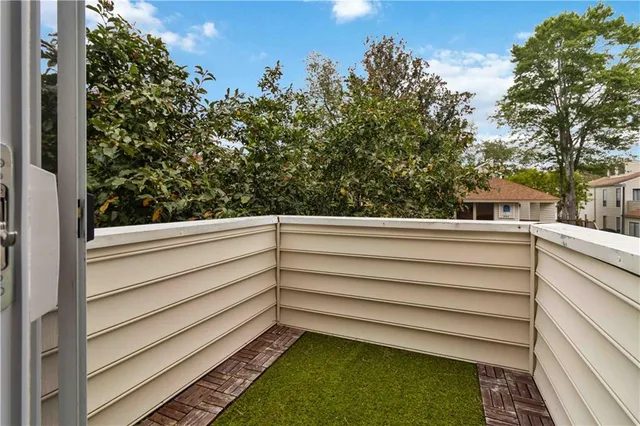 a view of wooden fence and trees