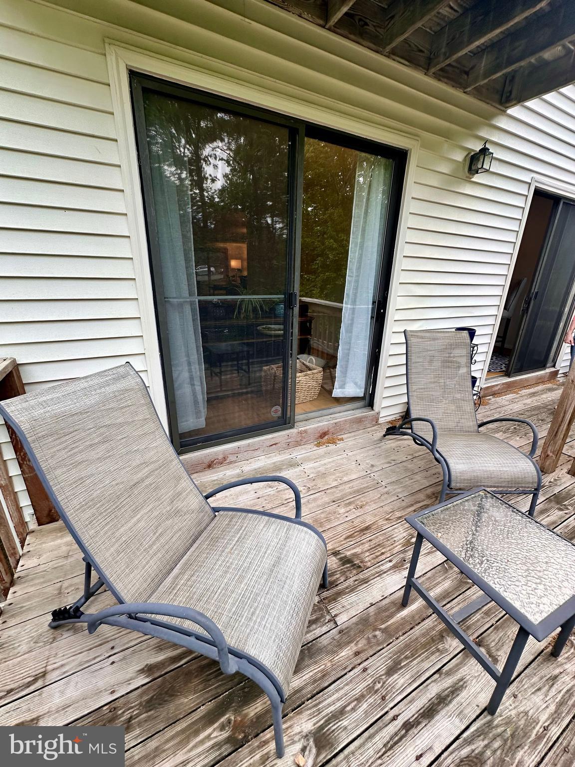 7929 Valleyfield Drive Springfield, VA 22153 - Photo 14 of 39 a view of a balcony with chair and wooden floor