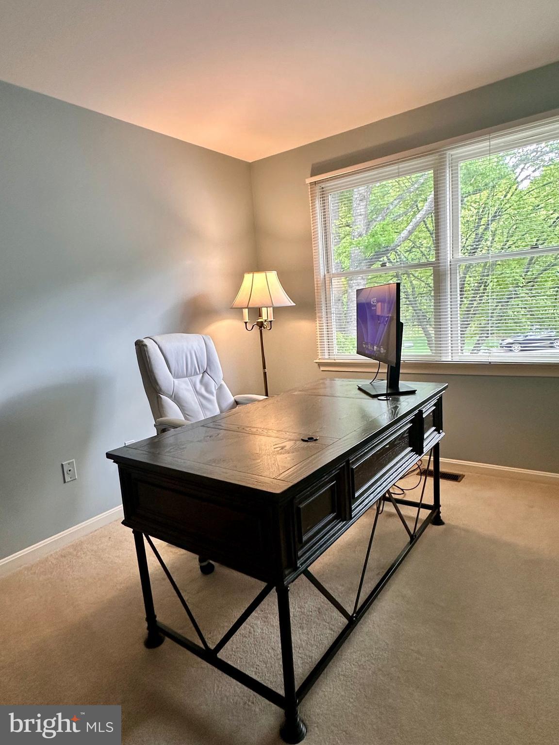 7929 Valleyfield Drive Springfield, VA 22153 - Photo 17 of 39 a view of a dining room with furniture and a window