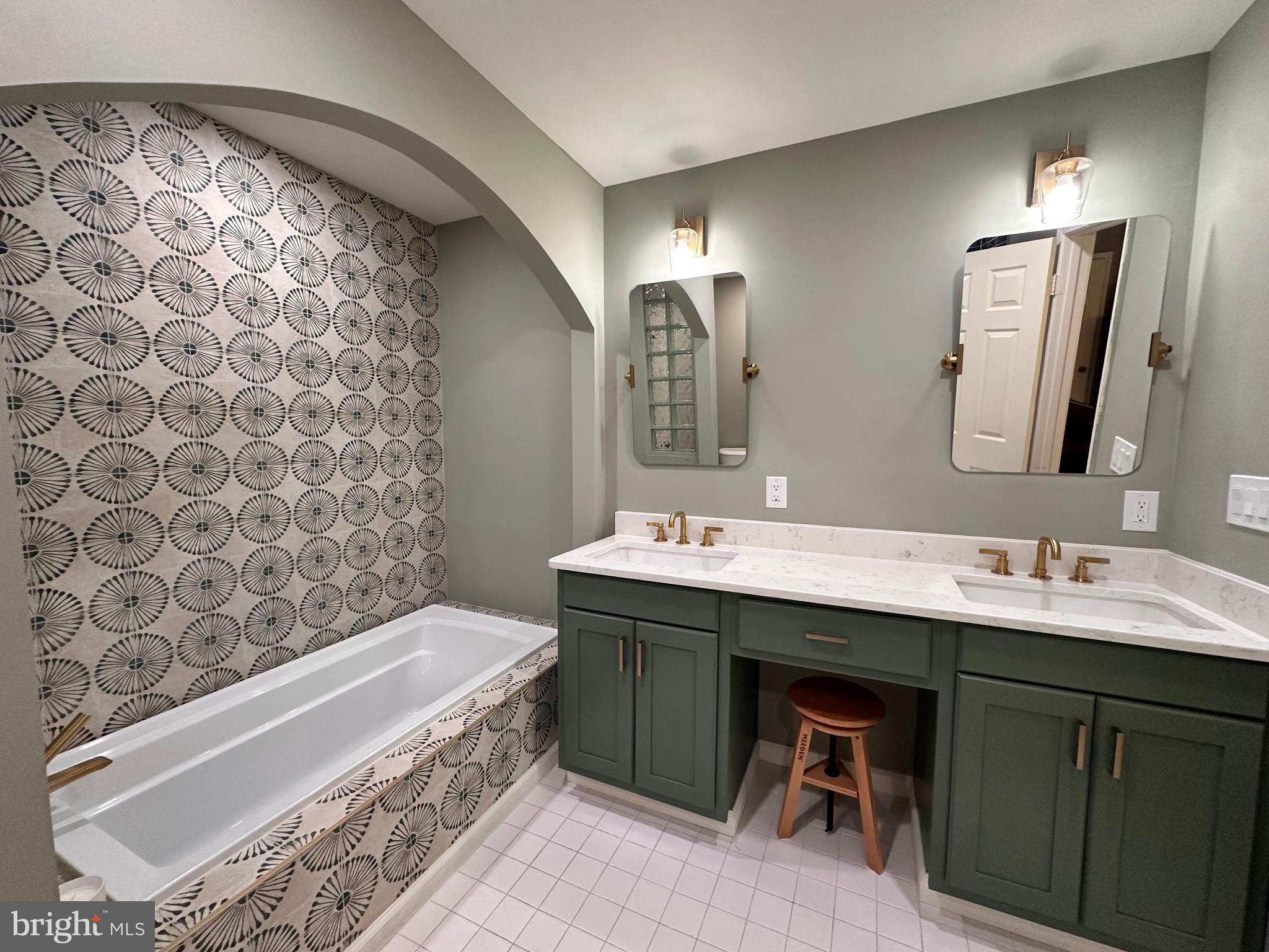 7929 Valleyfield Drive Springfield, VA 22153 - Photo 28 of 39 a bathroom with a double vanity sink mirror and bathtub