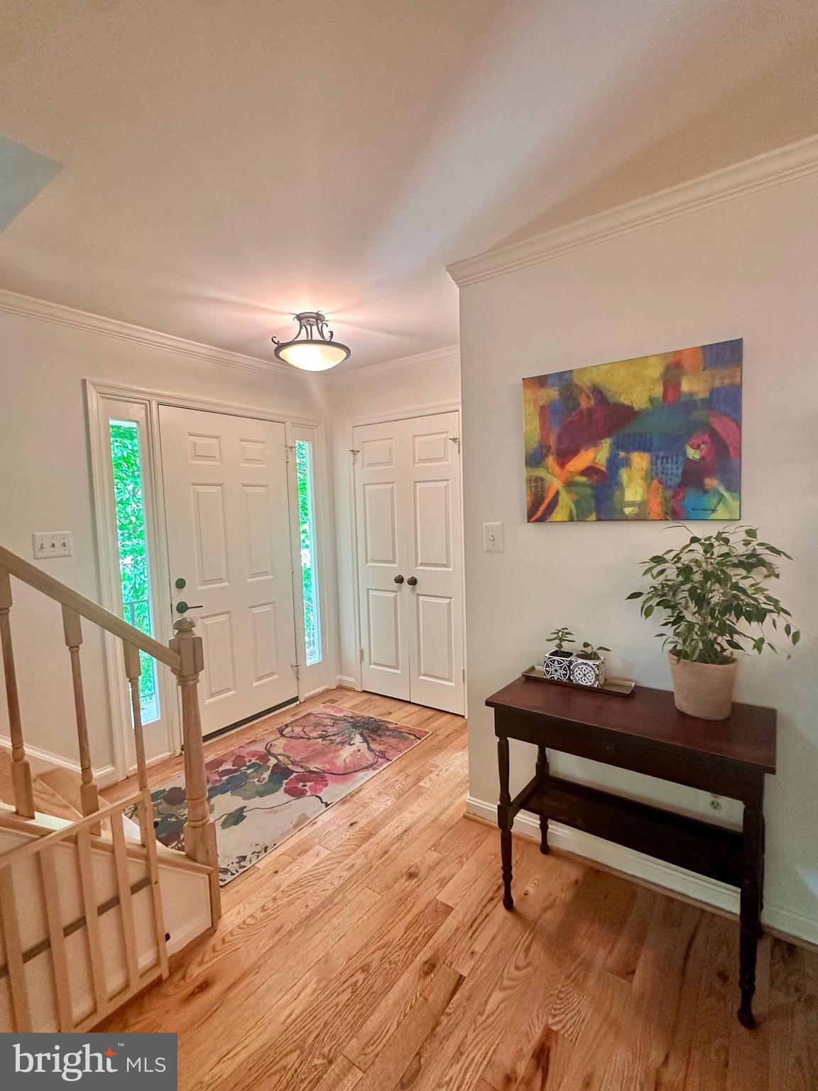 7929 Valleyfield Drive Springfield, VA 22153 - Photo 4 of 39 a living room with furniture and a painting on the wall