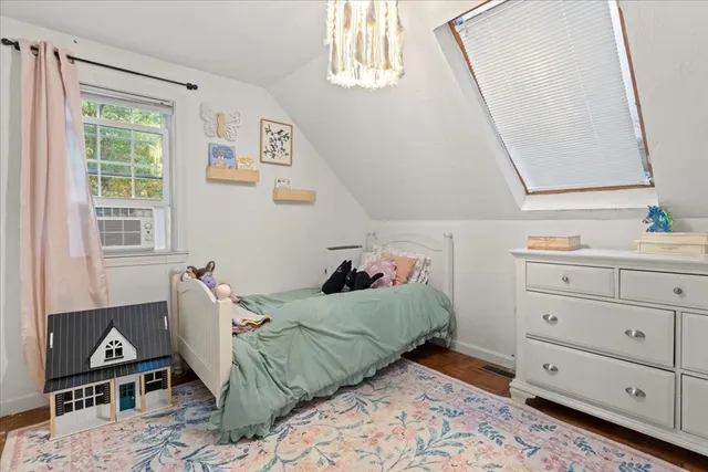 a bed room with a bed and a window