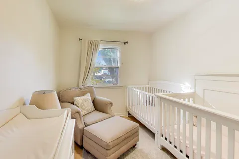 a view of a hallway with closet and entryway