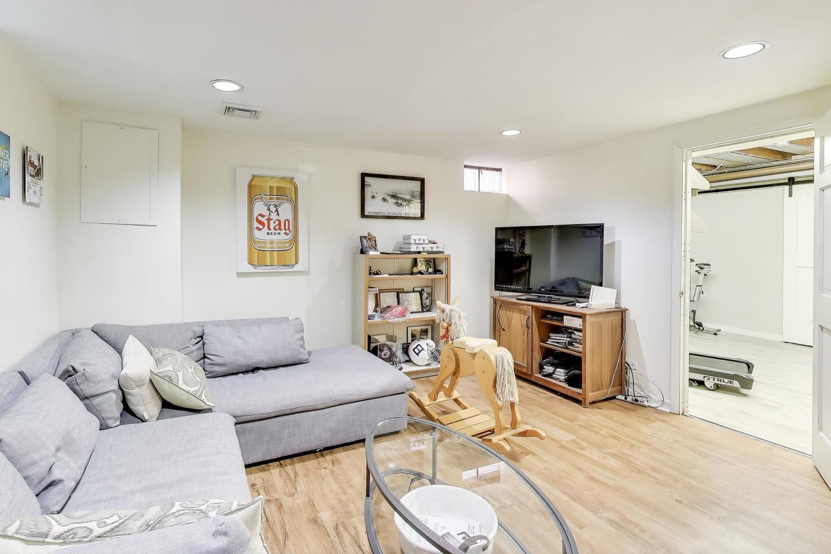3131 Central Street Evanston, IL 60201 - Photo 19 of 28 a living room with furniture and a flat screen tv