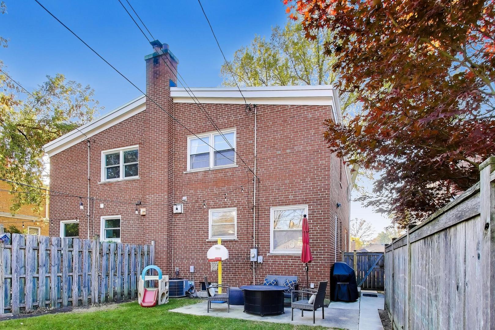 3131 Central Street Evanston, IL 60201 - Photo 21 of 28 a front view of a house with garden