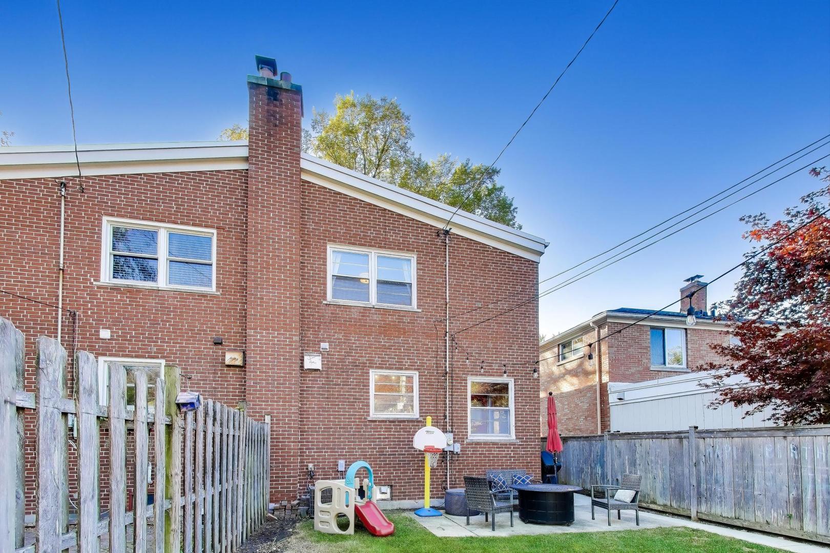 3131 Central Street Evanston, IL 60201 - Photo 22 of 28 a front view of a house with a garden