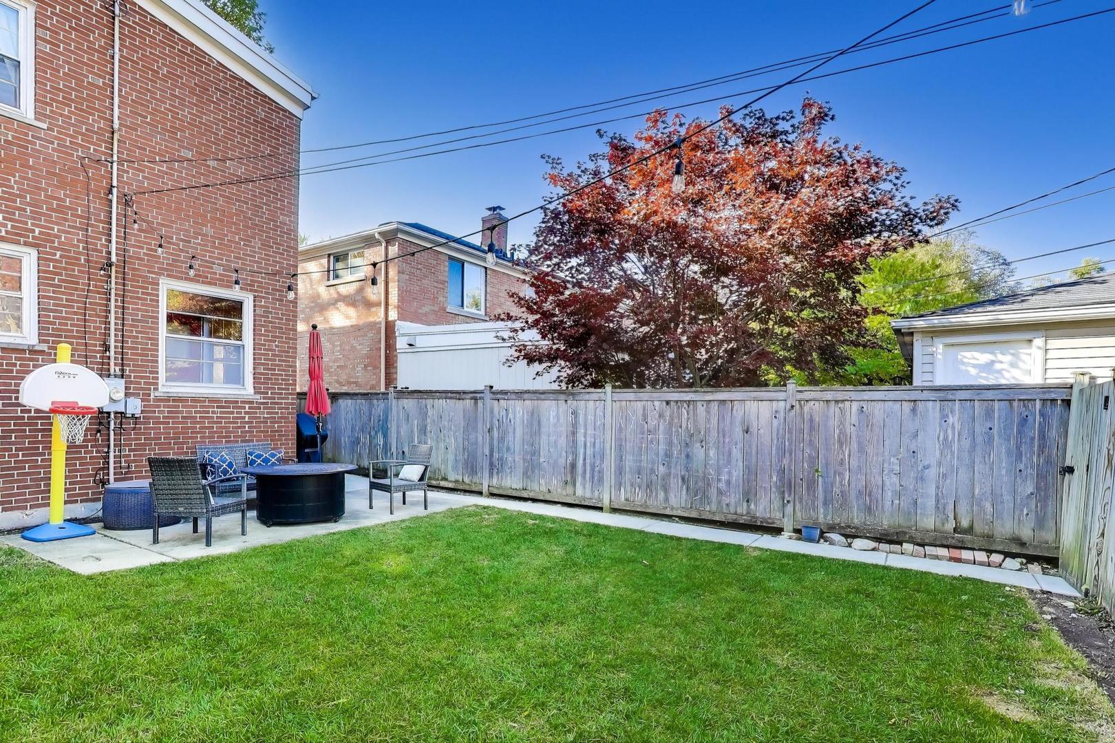 3131 Central Street Evanston, IL 60201 - Photo 26 of 28 a front view of a house with garden