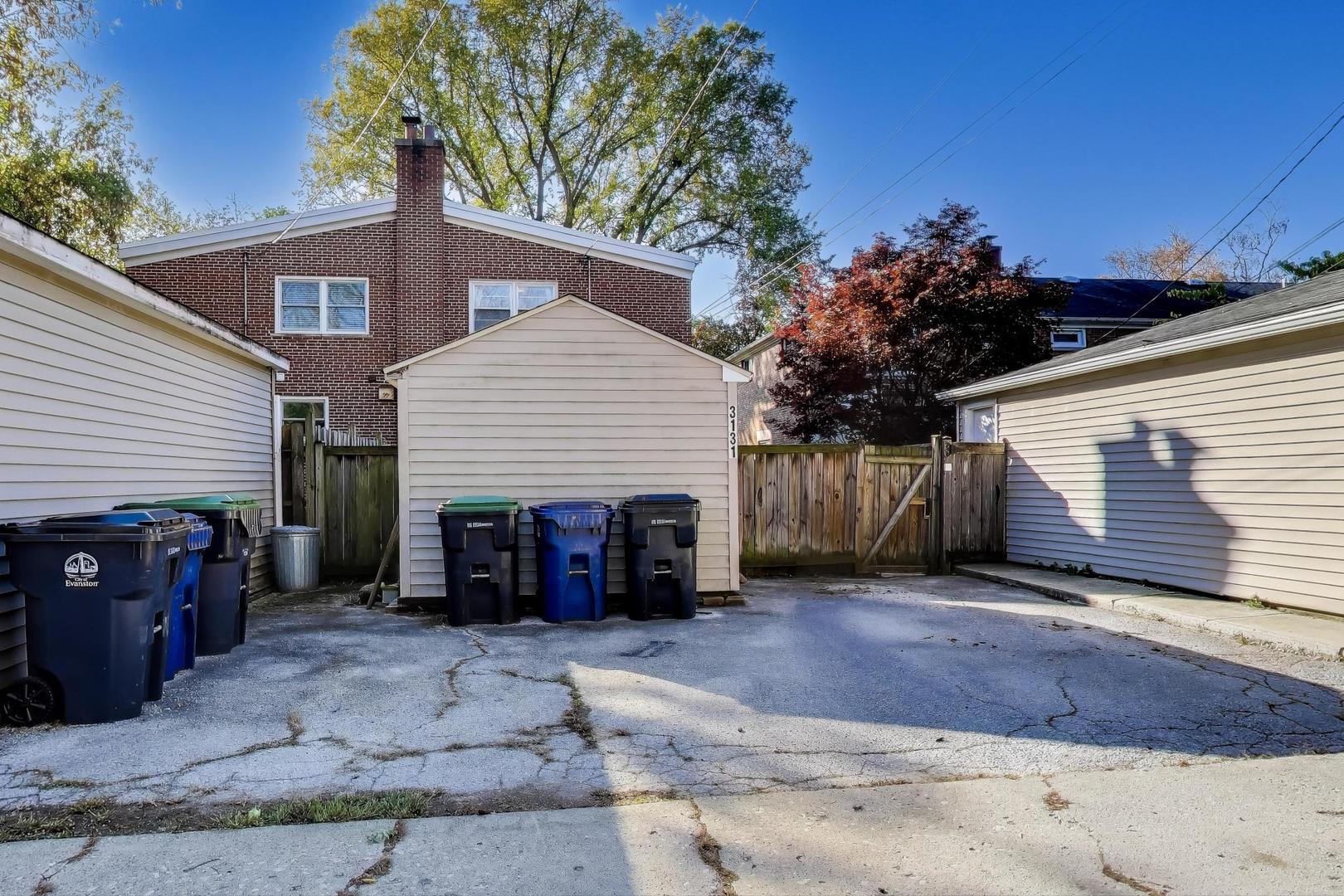 3131 Central Street Evanston, IL 60201 - Photo 28 of 28 a view of a house with a yard and garage