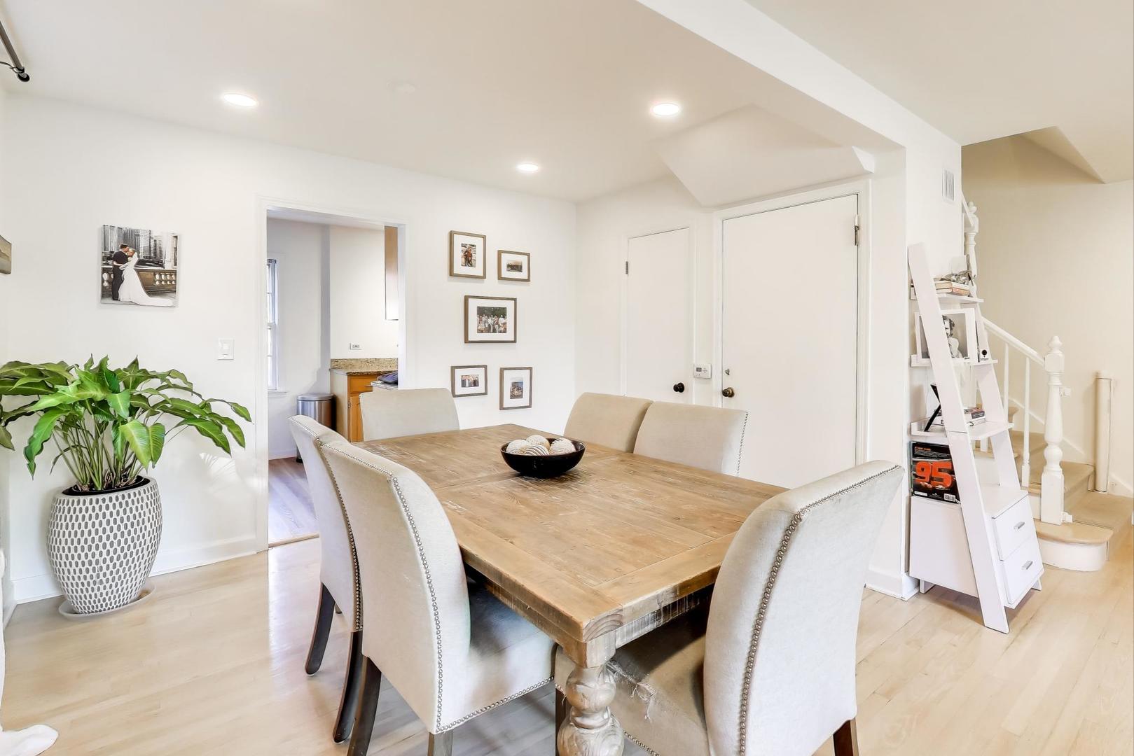 3131 Central Street Evanston, IL 60201 - Photo 5 of 28 a view of a dining room with furniture and a potted plant