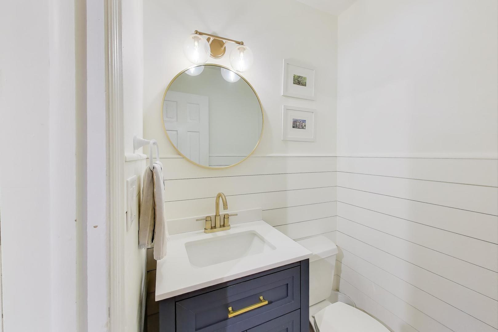 3131 Central Street Evanston, IL 60201 - Photo 9 of 28 a bathroom with a toilet a sink and mirror