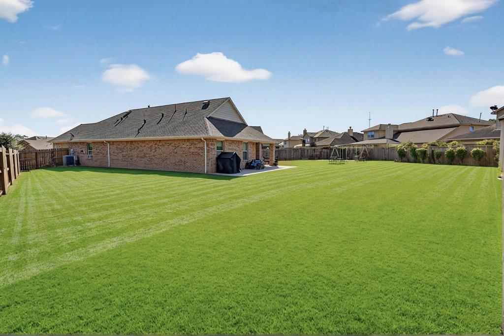 22038 Pheasant Bend Lane Porter, TX 77365 - Photo 23 of 25 a big house with a big yard and large trees