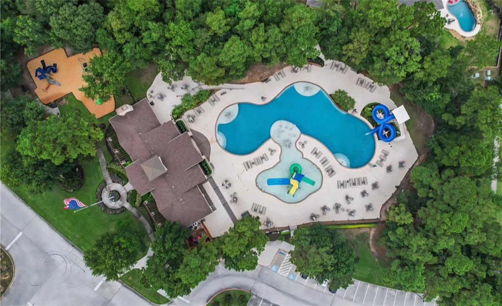 22038 Pheasant Bend Lane Porter, TX 77365 - Photo 25 of 25 an aerial view of a house with a swimming pool and garden