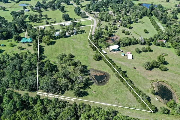 an aerial view of a yard with a garden