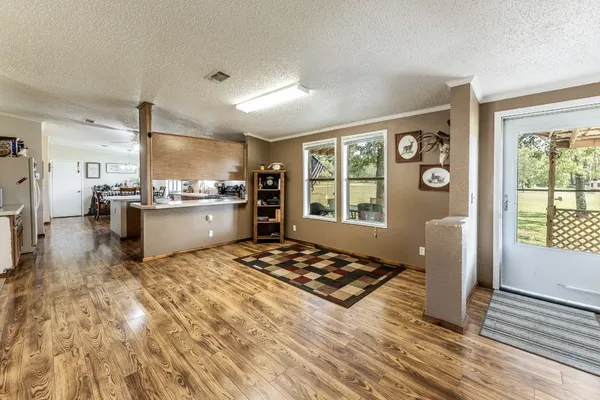 a kitchen with a stove a refrigerator and a cabinets