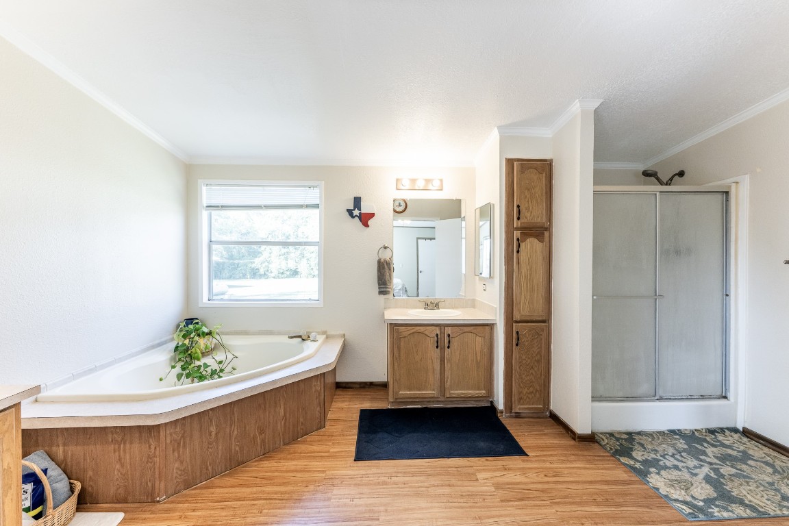 34 Harding Road Huntsville, TX 77340 - Photo 17 of 28 a spacious bathroom with a tub shower and sink
