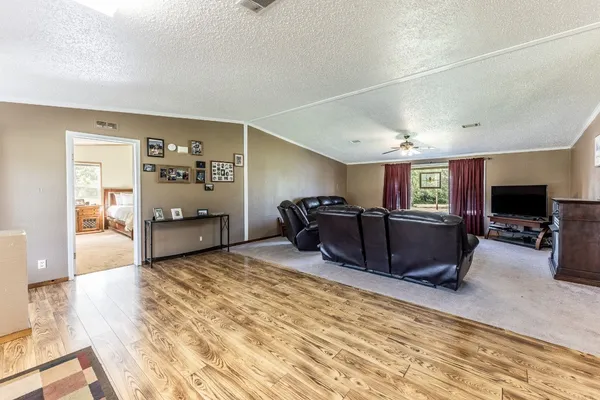 a large room with furniture and a flat screen tv