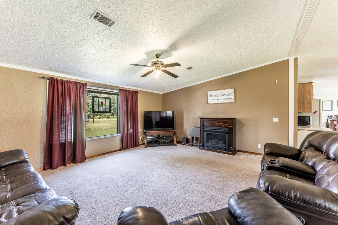 34 Harding Road Huntsville, TX 77340 - Photo 8 of 28 a living room with furniture and a fireplace