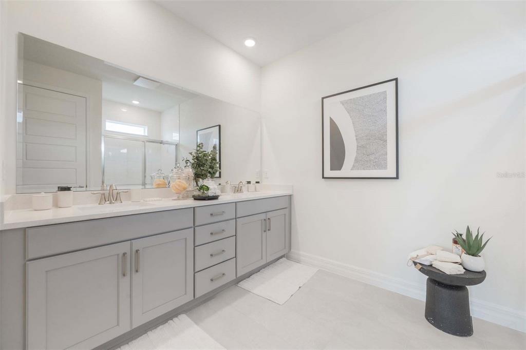 3952 Kennebunk Loop Mount Dora, FL 32757 - Photo 26 of 36 a bathroom with a double vanity sink and a