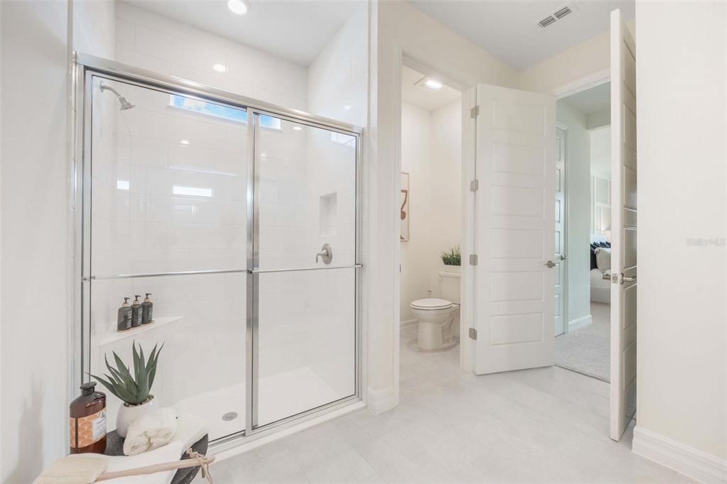 3952 Kennebunk Loop Mount Dora, FL 32757 - Photo 27 of 36 a bathroom with a shower and a sink
