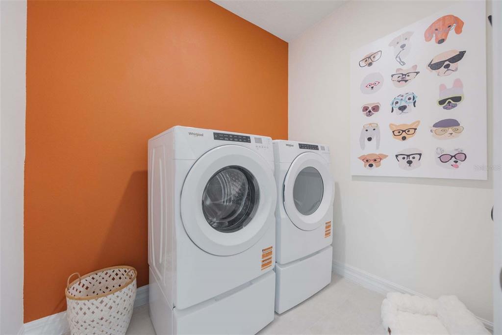 3952 Kennebunk Loop Mount Dora, FL 32757 - Photo 28 of 36 a utility room with dryer and washer