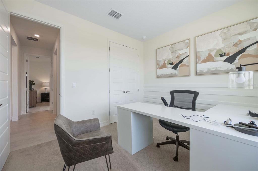 3952 Kennebunk Loop Mount Dora, FL 32757 - Photo 31 of 36 a view of a workspace with furniture and a lamp