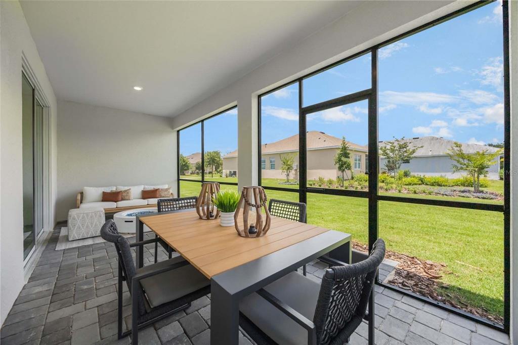 3952 Kennebunk Loop Mount Dora, FL 32757 - Photo 36 of 36 a view of a dining room with furniture window and outside view