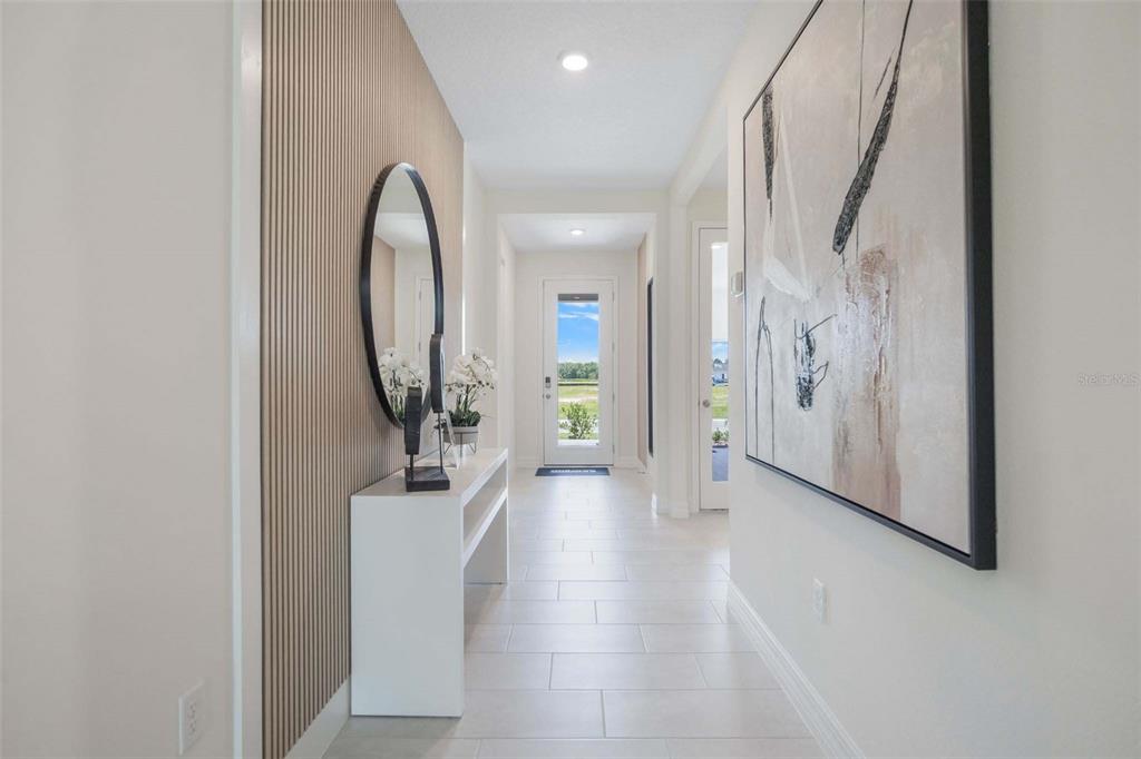 3952 Kennebunk Loop Mount Dora, FL 32757 - Photo 5 of 36 a view of a hallway with wooden floor and entryway