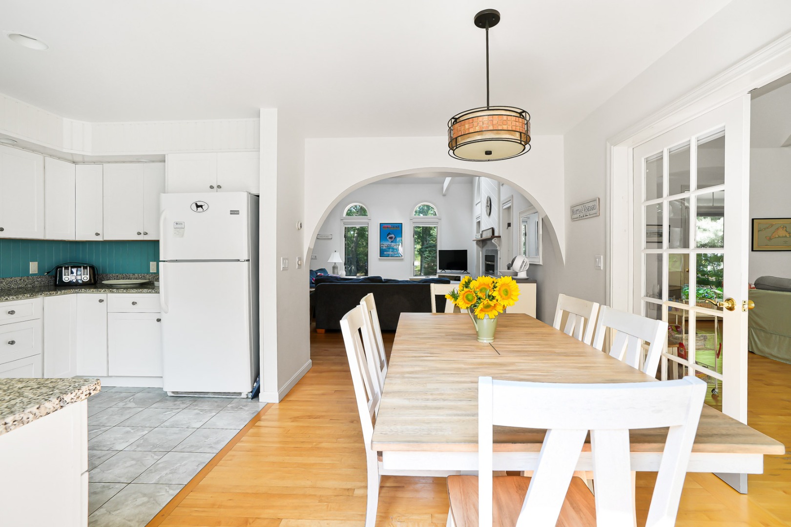 12 Duarte Circle Edgartown, MA 02539 - Photo 13 of 43 a view of dining room and kitchen with a table chairs