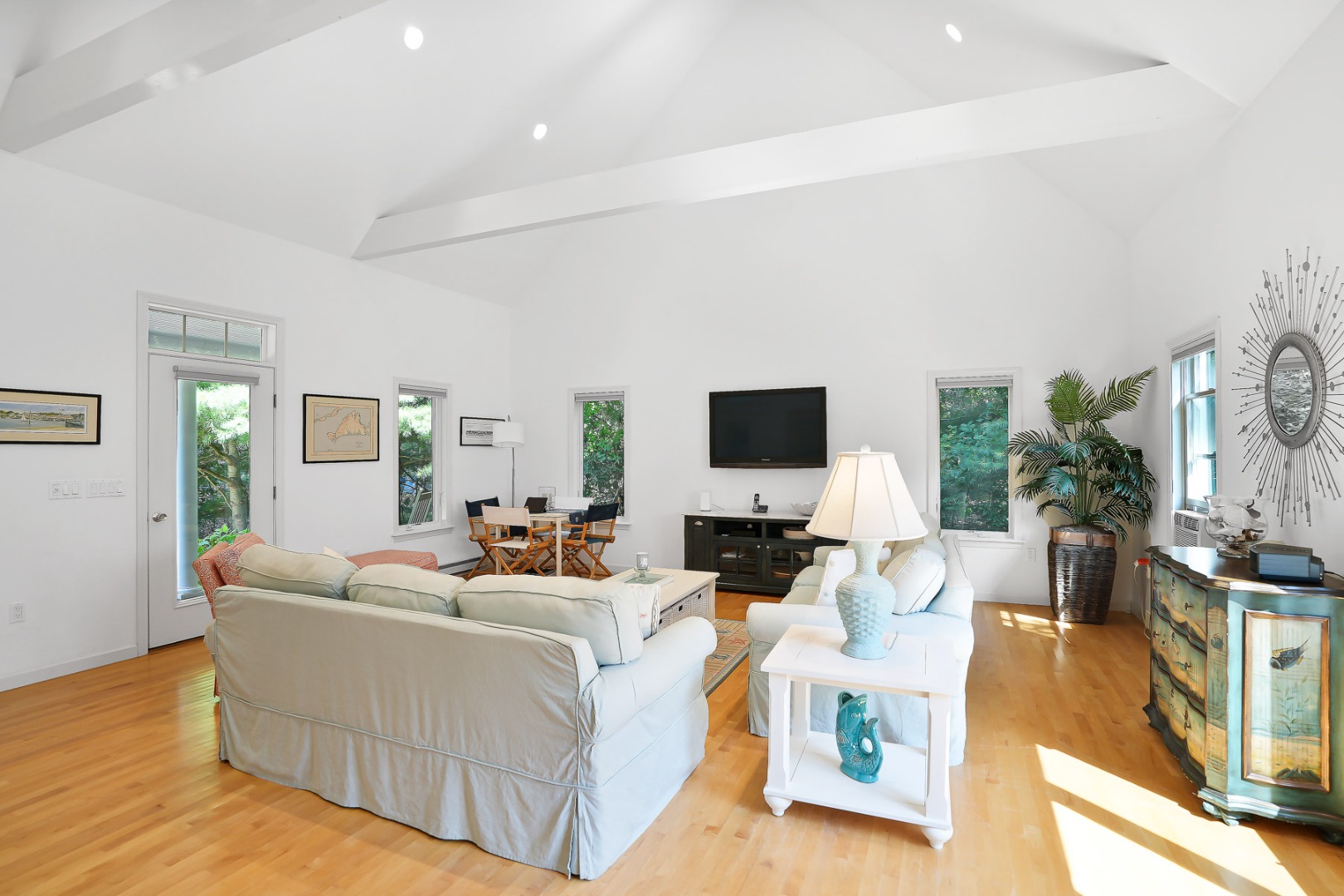 12 Duarte Circle Edgartown, MA 02539 - Photo 17 of 43 a living room with furniture a flat screen tv and a large window