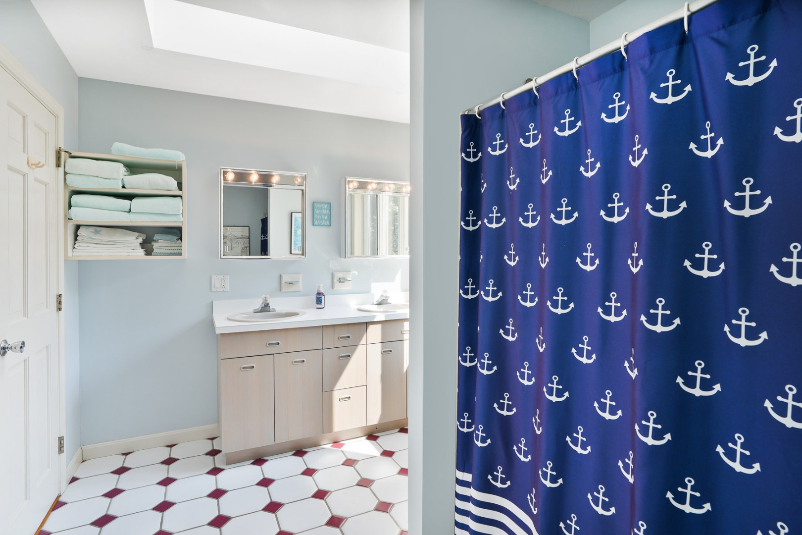 12 Duarte Circle Edgartown, MA 02539 - Photo 25 of 43 a bathroom with a sink a mirror and a shower