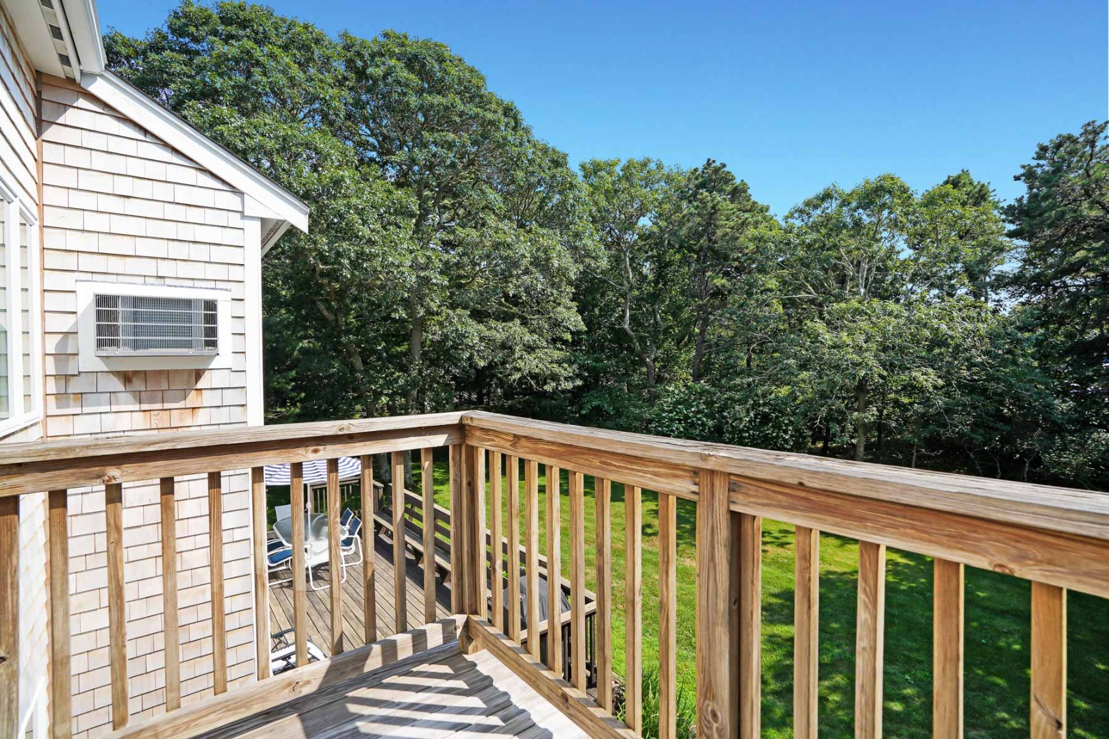 12 Duarte Circle Edgartown, MA 02539 - Photo 30 of 43 a view of balcony with wooden floor and fence